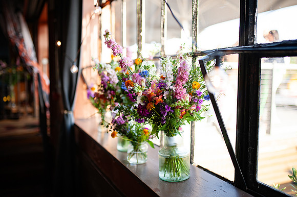 wedding floral arrangements at the mud dock cafe wedding reception-2